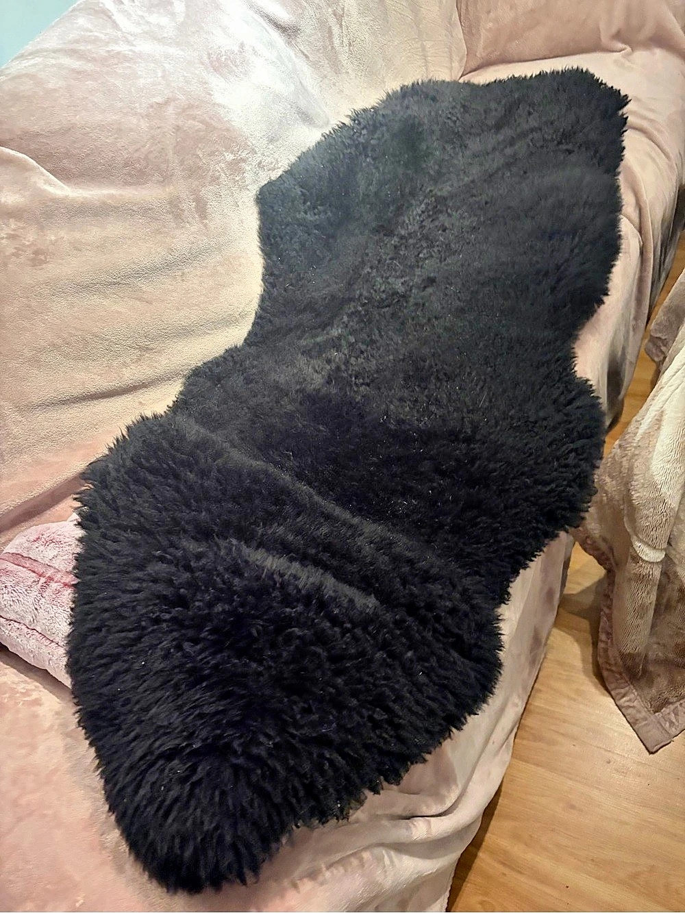 Black sheepskin rug